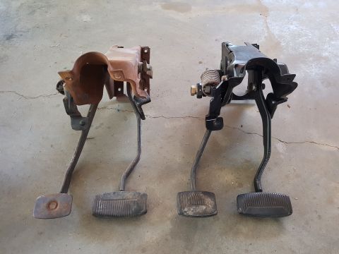 1978 Ford Bronco - Comparison of two brake and clutch pedal assemblies, one showing rust and the other recently painted.