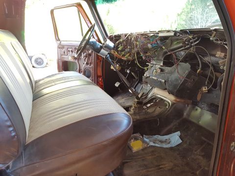 1978 Ford Bronco - Vehicle interior showing extensive wiring and disassembled dashboard components, likely undergoing repairs.