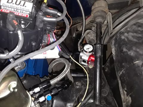 1985 Ford Bronco - Custom fuel system components and ignition distributor visible in the engine bay.