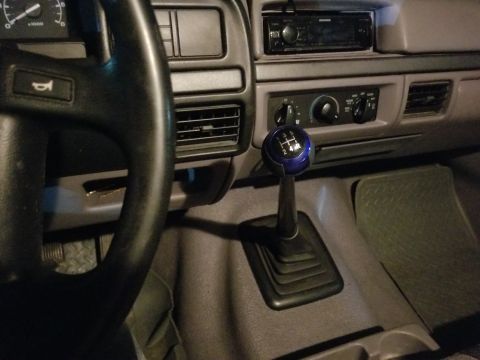 1995 Ford F-150 - This cheapo shifter knob almost matches the exterior color, and cost a lot less than an OE knob would have, if I could have found one. It i…