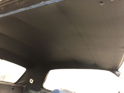 1968 Mercury Cougar - The headliner of a vehicle is shown, with visible seams and mounting hardware.