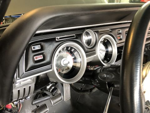 1968 Mercury Cougar - The interior of a 1968 Mercury Cougar shows its distinctive dashboard layout with prominent gauges and controls.
