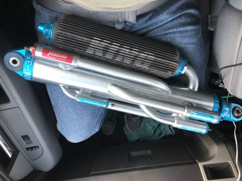 1979 Ford Bronco - Two King 3.5 shocks, one with a black finned reservoir, are shown inside a vehicle.