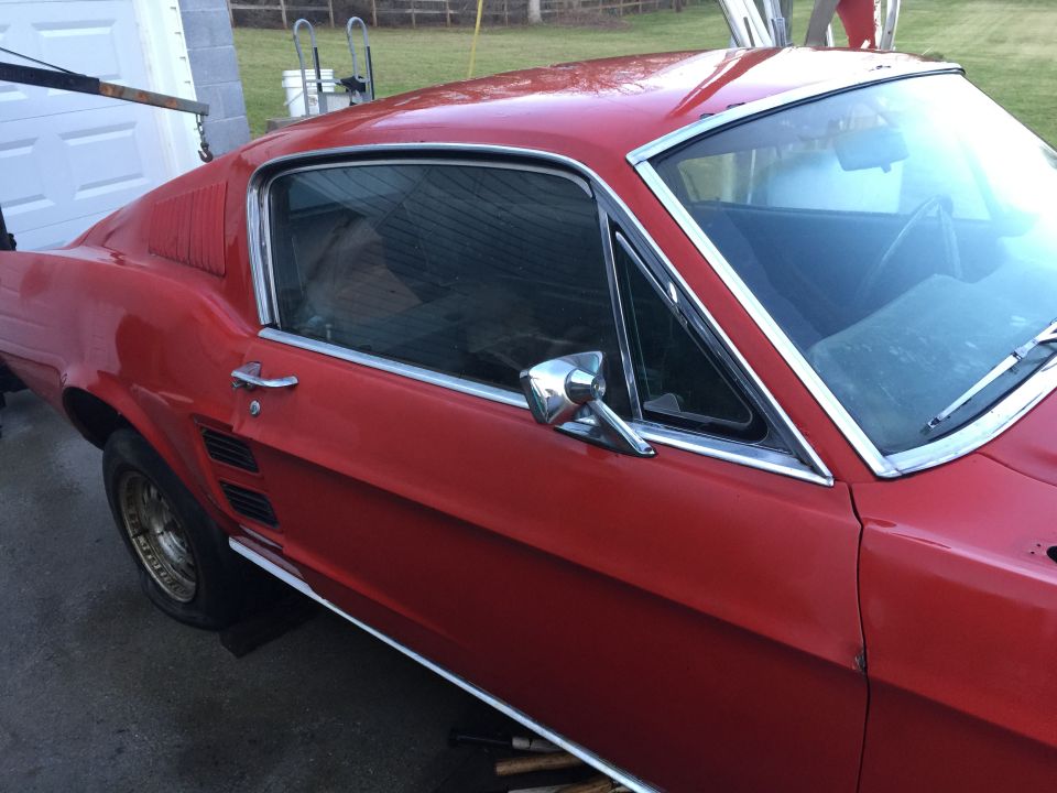 Red 1967 Ford Mustang fastback, 3/4 front view