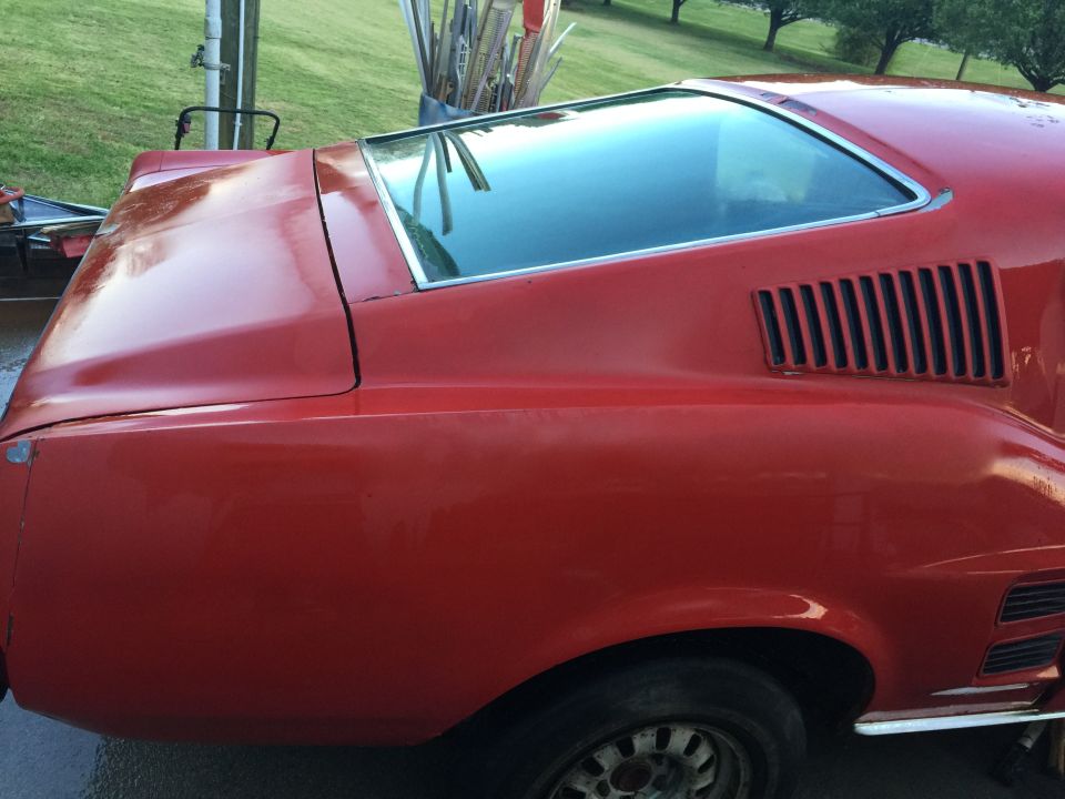 1967 Ford Mustang rear quarter panel with louvers and chrome trim