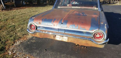 1962 Ford Galaxie - This 1962 Ford Galaxie shows significant rust and peeling paint on its rear end.