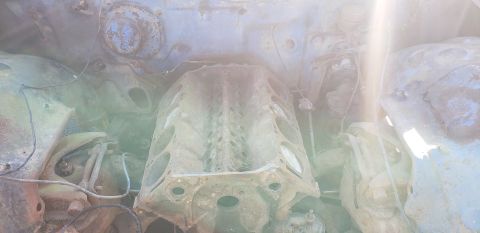 1962 Ford Galaxie - The engine block is heavily rusted and appears to be from a salvaged vehicle.
