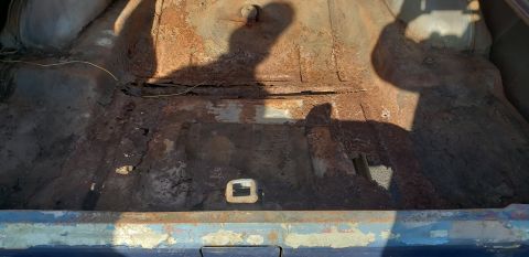 1962 Ford Galaxie - The interior of a car trunk shows significant rust and damage, with a watermark from Supermotors.net visible.
