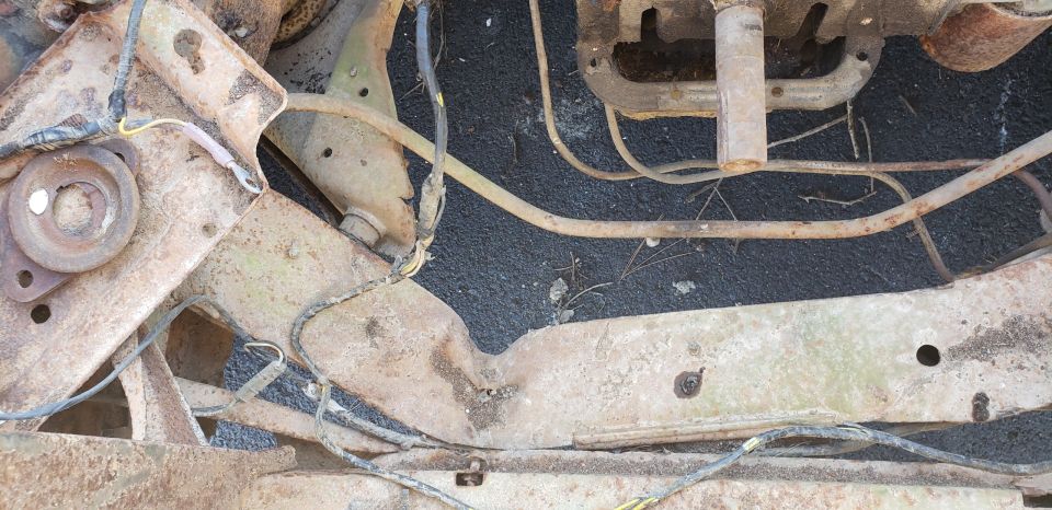 rusted vehicle frame and suspension components with wiring