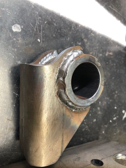 1992 Jeep Wrangler - A close-up view of a custom-welded metal part, likely for automotive modification, with visible weld seams and a brushed finish.