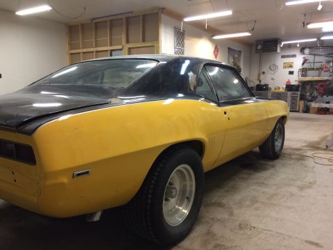 1969 Chevrolet Camaro - This 1969 Chevrolet Camaro, seen from a 3q-front angle, is undergoing restoration in a garage setting.