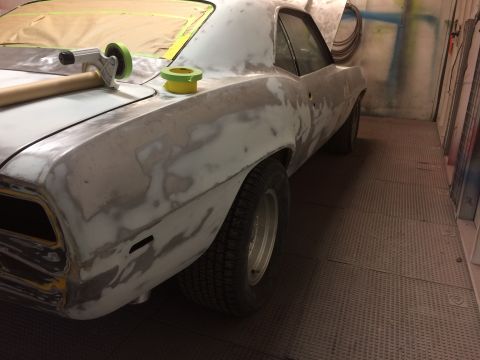 1969 Chevrolet Camaro - A 1969 Chevrolet Camaro is undergoing body repairs, showing extensive body filler and masking tape.