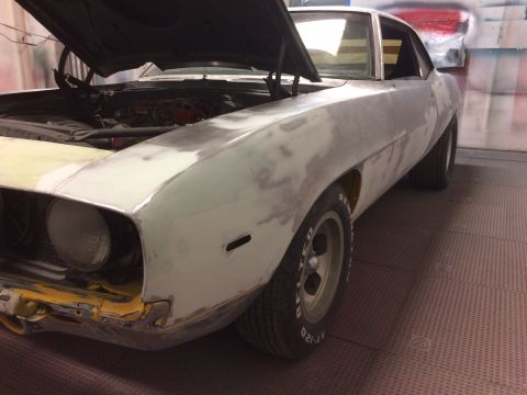 1969 Chevrolet Camaro - This 1969 Chevrolet Camaro is in the process of body repair, with its hood open and primer applied to the front end.