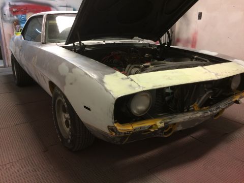 1969 Chevrolet Camaro - This 1969 Chevrolet Camaro is undergoing bodywork, with its hood open to reveal the engine.