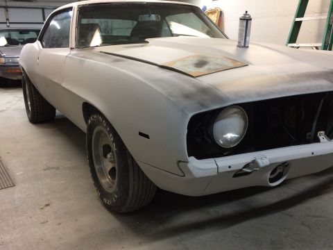 1969 Chevrolet Camaro - This 1969 Chevrolet Camaro is in primer, ready for paint. The classic muscle car is shown from a three-quarter front perspective.