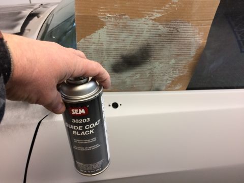 1969 Chevrolet Camaro - Applying guide coat to a car body panel for bodywork.