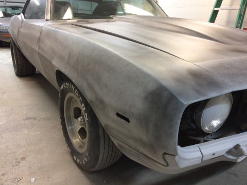 1969 Chevrolet Camaro - A 1969 Chevrolet Camaro in primer is shown from the front quarter angle, ready for paint.