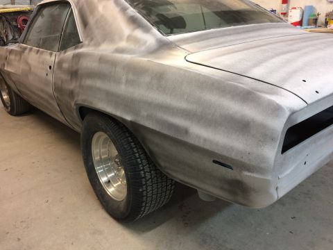 1969 Chevrolet Camaro - This 1969 Chevrolet Camaro is shown in primer, awaiting its final paint job. The rear quarter panel and wheel are visible.