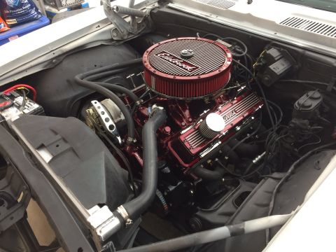1969 Chevrolet Camaro - The engine bay features a V8 engine with a prominent red Edelbrock air cleaner and polished chrome valve covers.