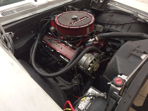 1969 Chevrolet Camaro - The engine bay features a V8 engine with red Edelbrock components and a large air filter.