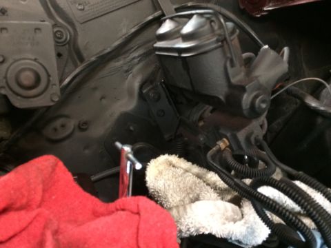 1969 Chevrolet Camaro - Close-up view of the brake master cylinder and fluid reservoir, likely from a classic car's engine compartment.