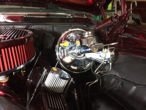 1969 Chevrolet Camaro - Close-up of the engine bay, highlighting the chrome brake booster and air intake system.