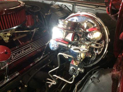 1969 Chevrolet Camaro - Close-up of a modified engine bay, focusing on the brake booster and valve covers.