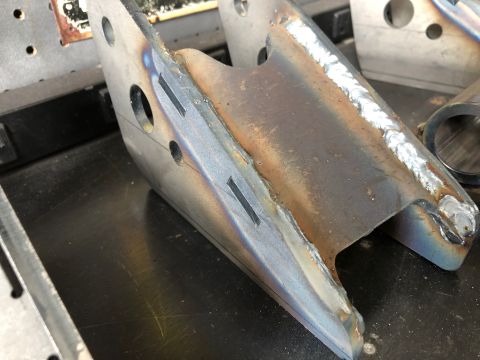 1992 Jeep Wrangler - This is a close-up of a metal bracket, likely a vehicle part, showing signs of welding and fabrication.