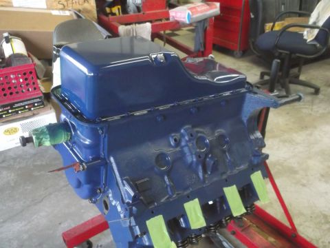 1967 Ford Galaxie - Engine block painted blue and mounted on an engine stand for work.