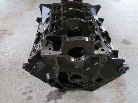 1970 Ford Torino - A bare engine block sits on a concrete surface, with the Supermotors.net logo in the corner.