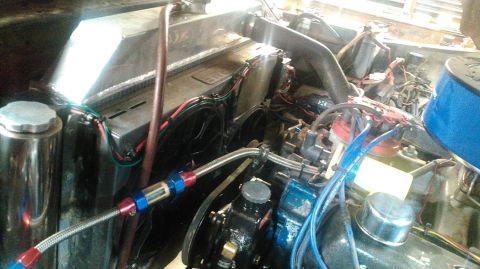 1978 Ford Bronco - Close-up view of a vehicle's engine bay, an aluminum radiator and various engine components.