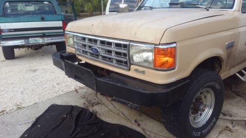 1990 Ford F-250 - definatly sticks out more than the original bumper. gives a nice step to work on the truck at least.