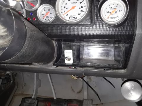 1985 Ford Bronco - Close-up view of a vehicle's dashboard, showing various gauges and controls.