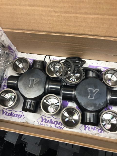 1992 Jeep Wrangler - A close-up view of Yukon brand universal joints and bearing cups laid out in a box.