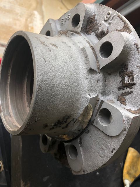 1992 Jeep Wrangler - A close-up view of a metal component, possibly a hub or flange, with visible wear and rust.