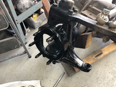 1992 Jeep Wrangler - Painted front axle knuckle assembly with studs and attached bracket.