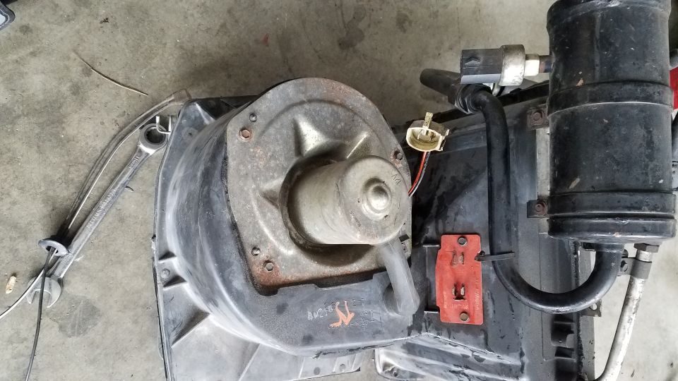 Blower motor assembly with hoses and electrical connector