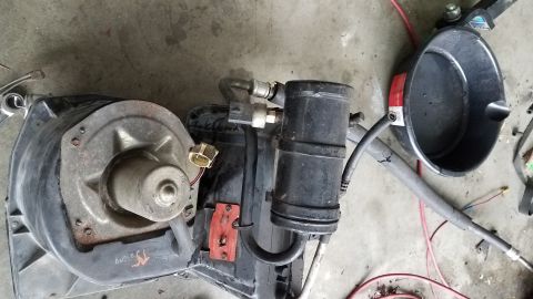 1985 Ford Bronco - Car AC blower motor and receiver-drier assembly removed from a vehicle.