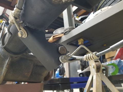 1983 Ford Bronco - I drilled the new shock mount for the original e-brake cable guide's bolt, and the brake line guide's bolt, so everything is routed & retai…