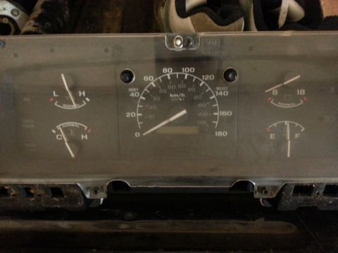 1978 Ford Bronco - Instrument cluster from a vehicle, showing various gauges and readouts.
