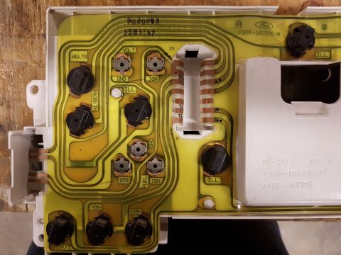 1978 Ford Bronco - Circuit board for a Ford vehicle's instrument cluster, showing various electrical components and labels.