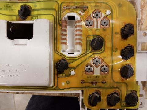 1978 Ford Bronco - Close-up of a Ford instrument cluster circuit board, showing various electrical components and part numbers.