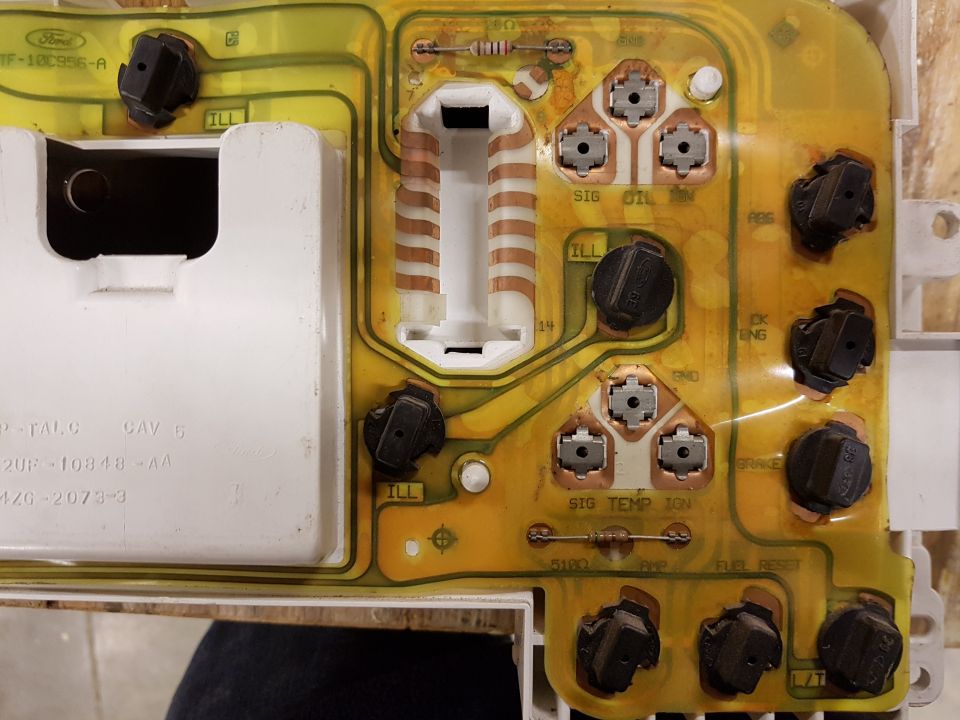 Instrument cluster circuit board with Ford logo and part numbers