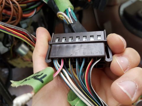 1978 Ford Bronco - Close-up of a vehicle's wiring harness connector with numbered slots and various colored wires.
