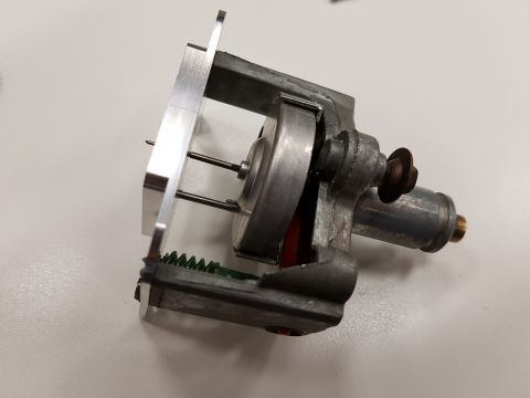 1978 Ford Bronco - A close-up view of a small electric motor assembly, likely a component from a larger mechanism.