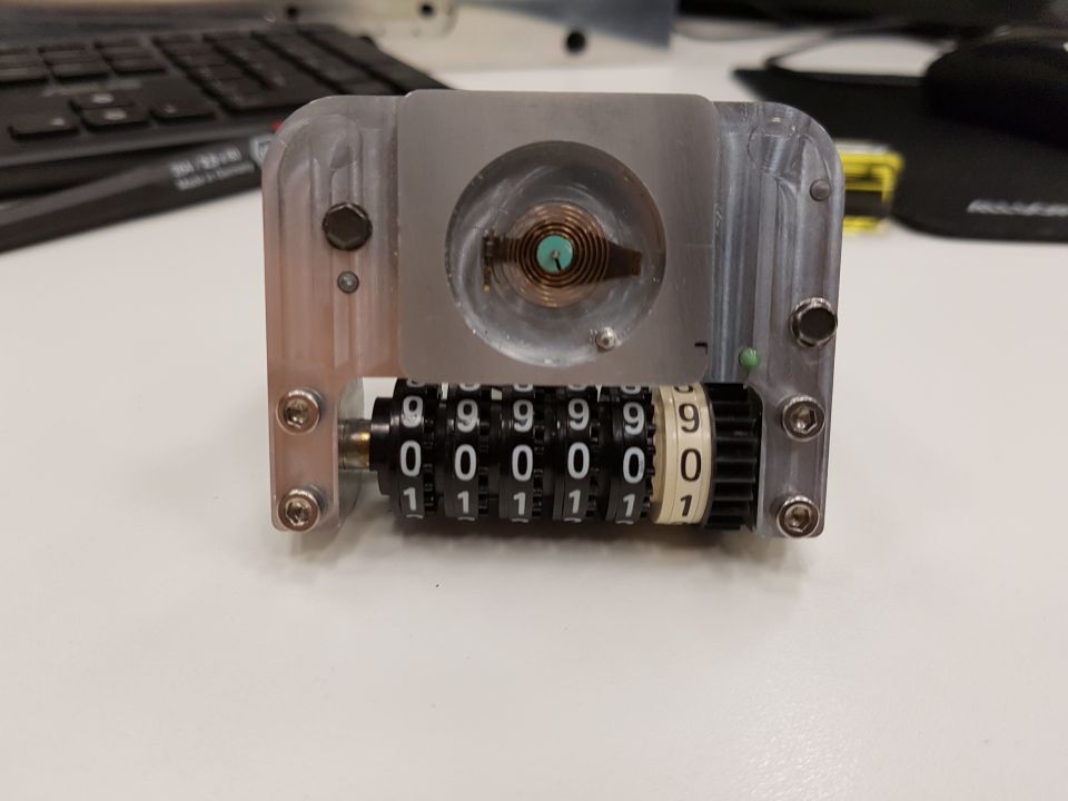 Mechanical counter with rotating number wheels showing 9999901.