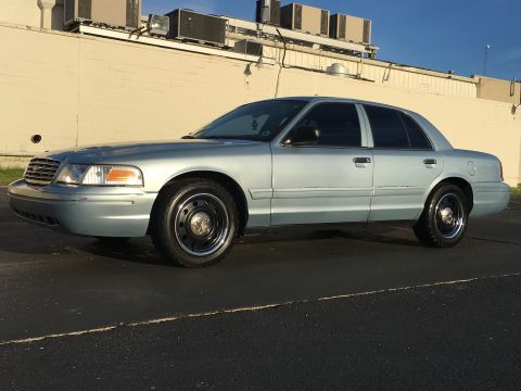 2006 Ford Crown Victoria - This 2006 Ford Crown Victoria is seen from a three-quarter front angle under a clear sky.