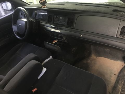2006 Ford Crown Victoria - Interior of a 2006 Ford Crown Victoria, showing the dashboard and front seating area.