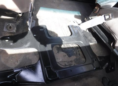 1992 Ford Bronco - F-series center jump seat bracket interferes with Bronco's floor-mounted seat belt receivers.