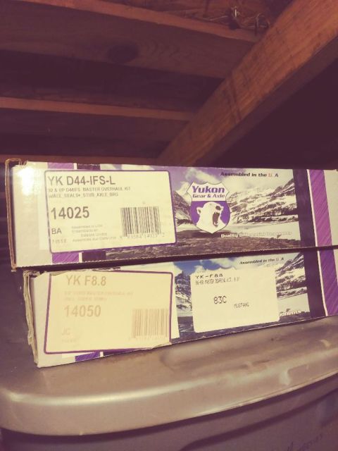 1996 Ford Bronco - Two Yukon Gear & Axle master overhaul kits are stacked on a shelf. The top box is for a YK D44-IFS-L, and the bottom box is for a YK F8.8.